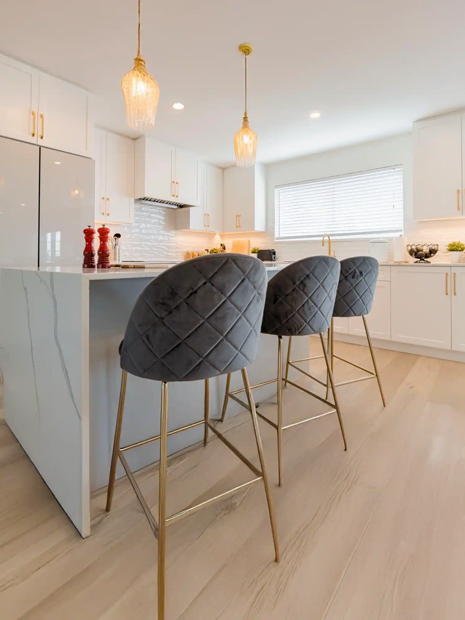 Modern kitchen renovation with white quartz island in Vancouver